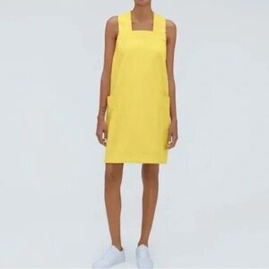 Everlane the cross-back apron mini denim dress organic cotton in lemon yellow